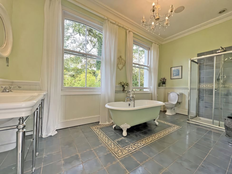 A bathroom with a bathtub and shower at Trenare in Truro