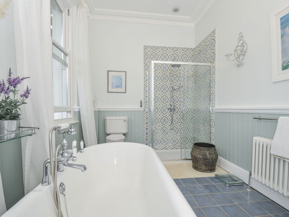 A bathroom with a bathtub and shower at Trenare in Truro