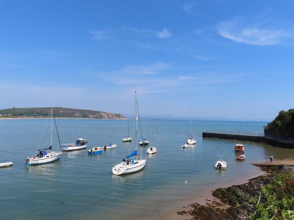 A view of boats on water at Machroes Cottage Pwllheli