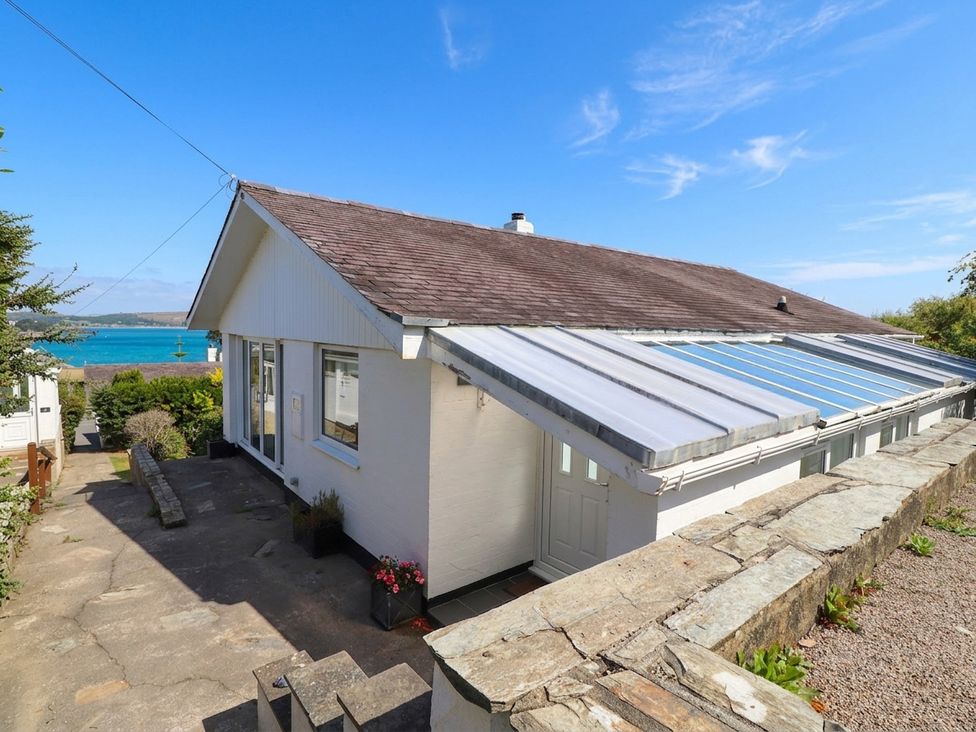 A house with windows and a pathway at Machroes Cottage Bwlchtocyn near Abersoch