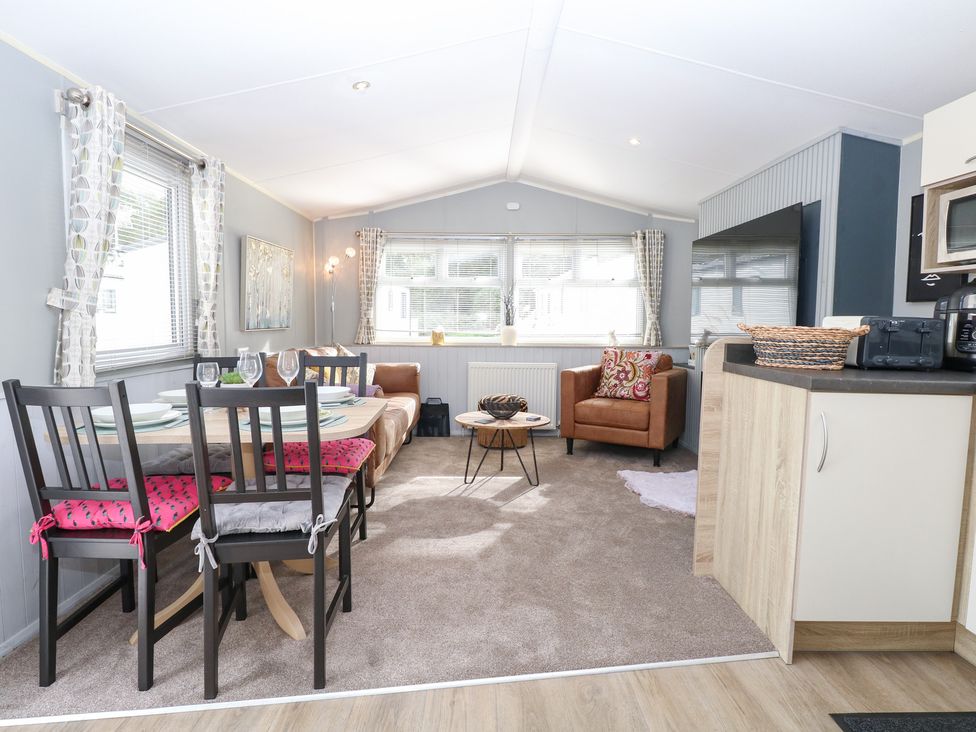A living room with a dining table and sofa at Number 34 Foxburrow Hang Great Yarmouth