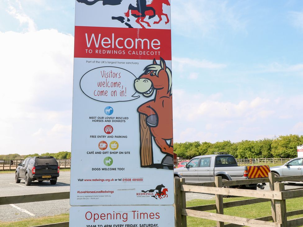 A welcome sign with horse illustration at Redwings Caldecott in Great Yarmouth