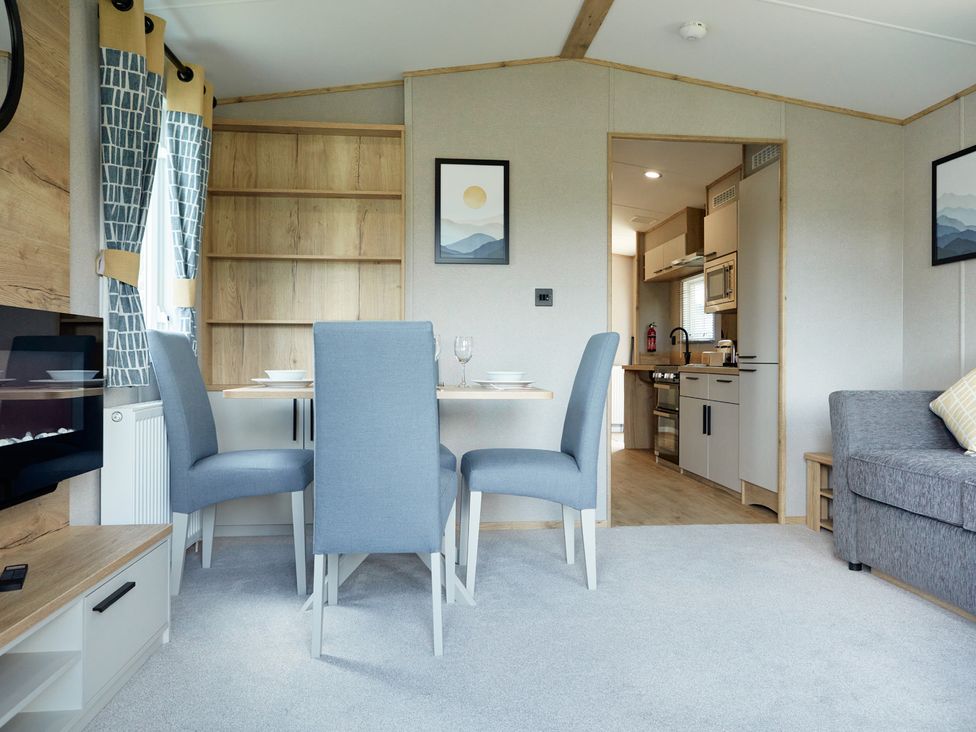 A dining room with table and chairs at Meadowview - Billing Aquadrome