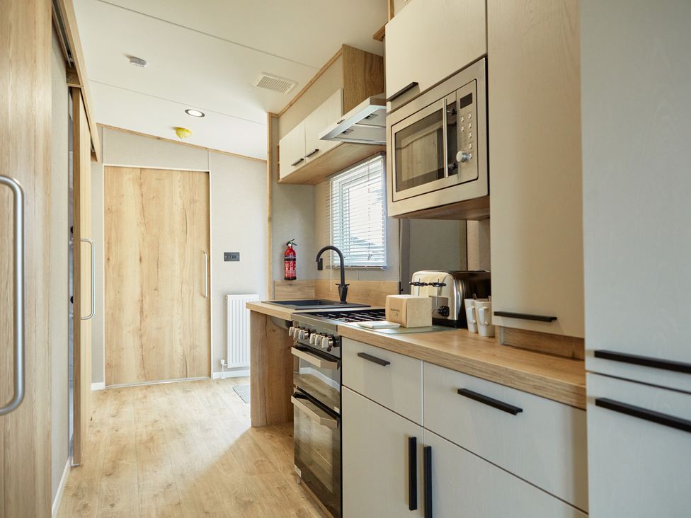 A kitchen with modern appliances at Meadowview - Billing Aquadrome
