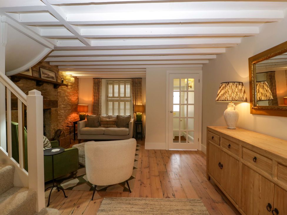 A living room with a sofa and coffee table at The Cottage in Stow-On-The-Wold