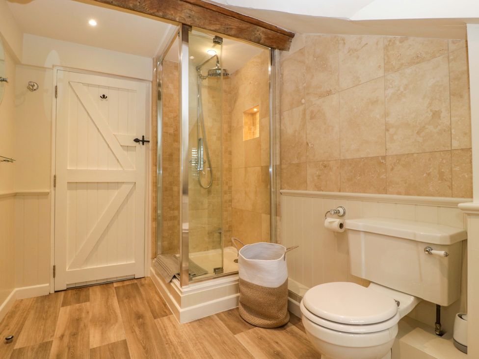 A bathroom with a shower and toilet at The Cottage in Stow-On-The-Wold
