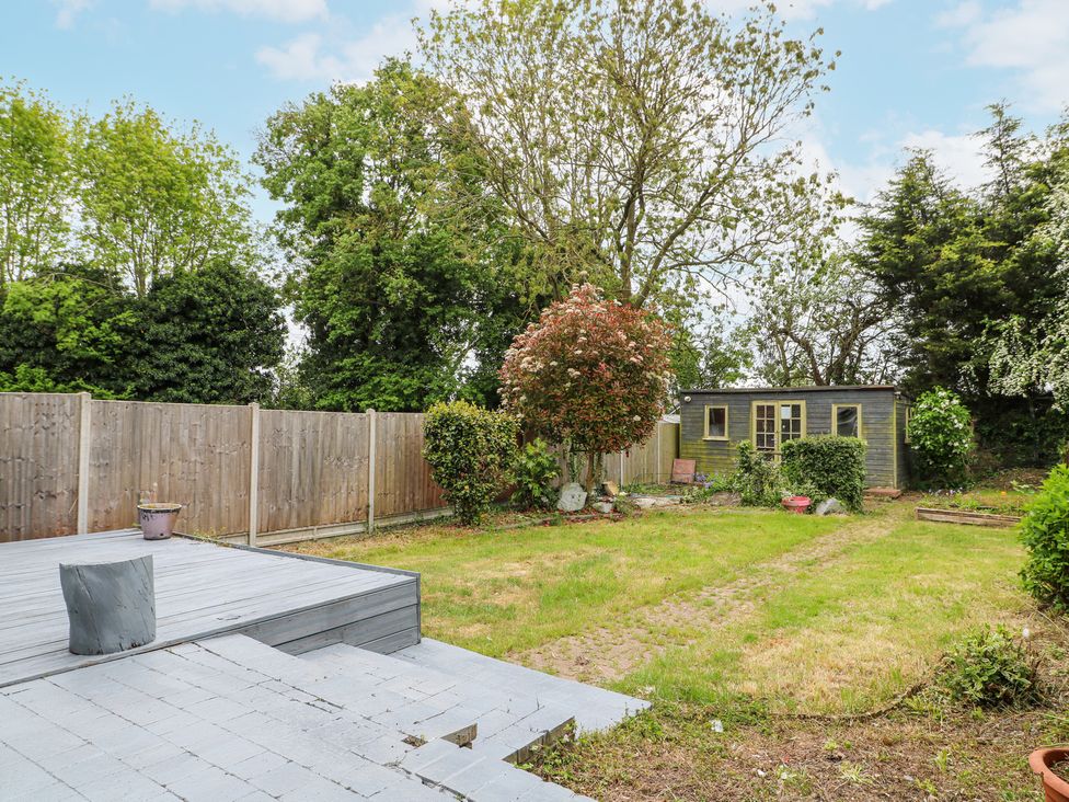 A backyard with a small garden shed and wooden fence at 46 Dalby Road in Antsey