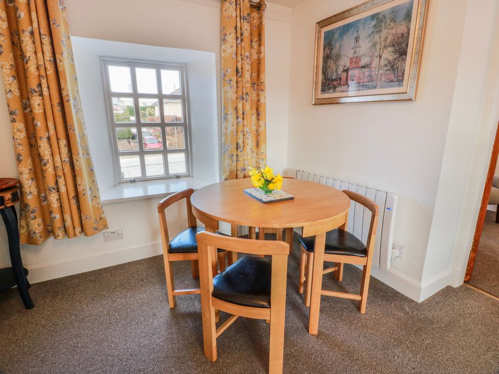 A dining room with a table and chairs at The Old Coach House in Lockerbie