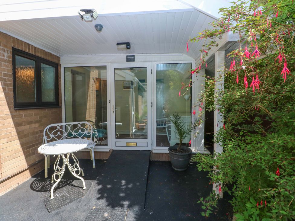 An entrance with a table and chairs at 170 Langland Road, Mumbles