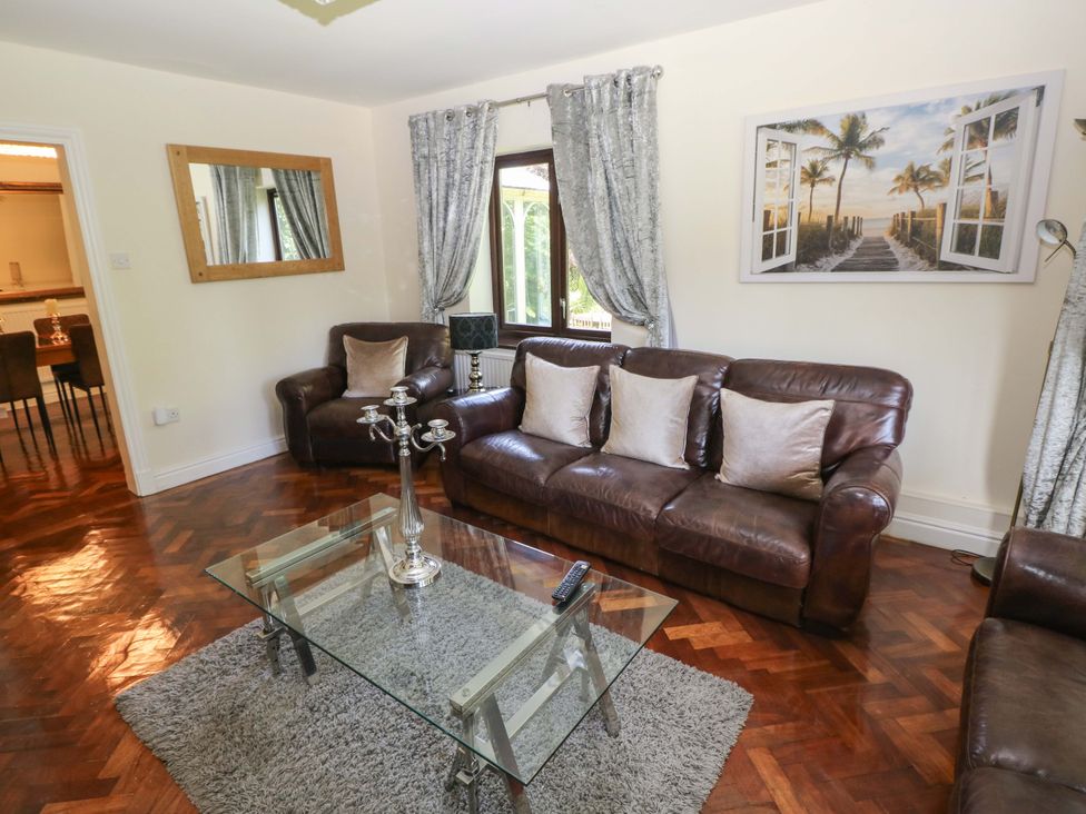 A living room with sofas and a coffee table at 170 Langland Road Mumbles