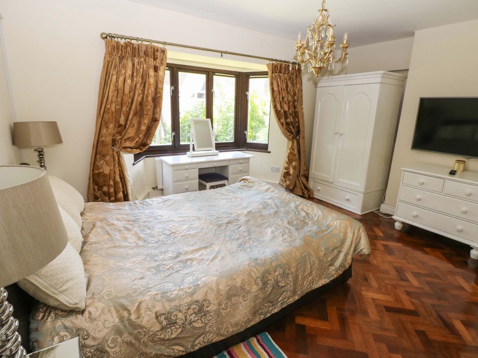 A bedroom with a bed and furniture at 170 Langland Road in Mumbles