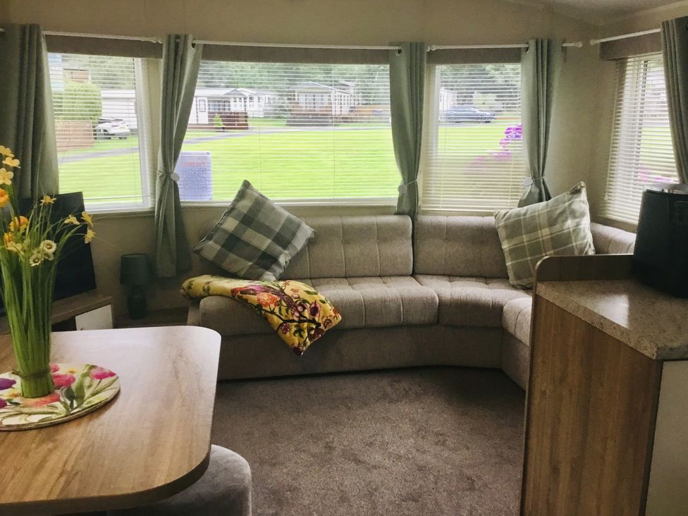 A living room with a couch and table at 38 The Green