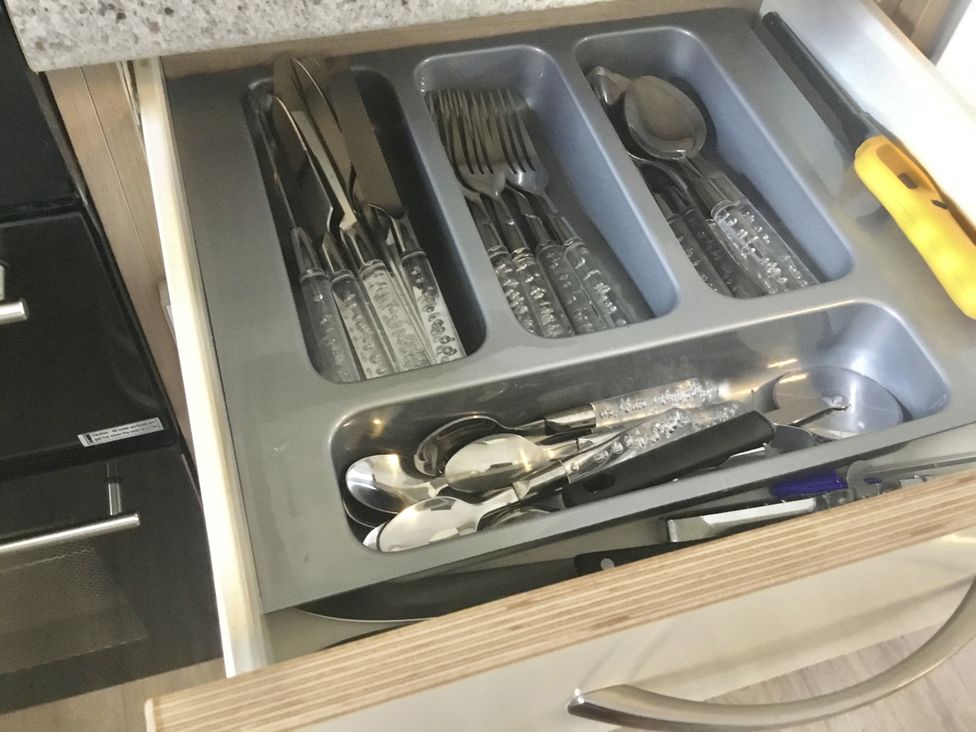 A drawer with cutlery and kitchen utensils at 38 The Green