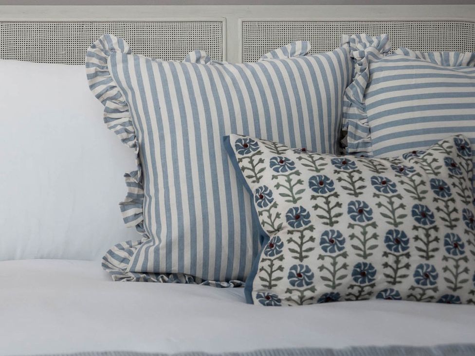 A collection of pillows on a bed at East Lodge, Peterborough