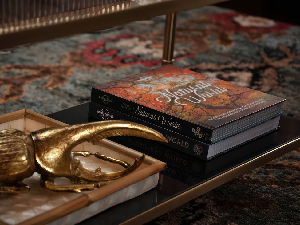 A coffee table with a book and a decorative object at The Gatehouse in Peterborough