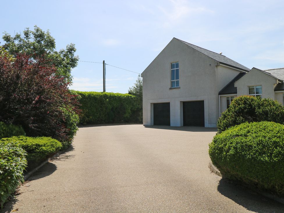A house with garage and driveway at The East Wing Apartment in Claremorris