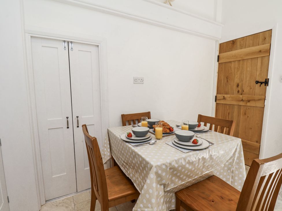 A dining room with a table set for breakfast at Rigg Cottage Sandsend