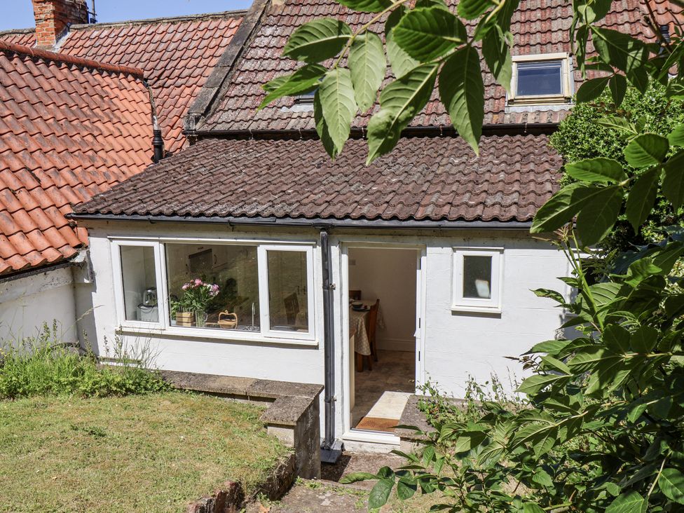 A view of the exterior with a door and windows at Rigg Cottage in Sandsend