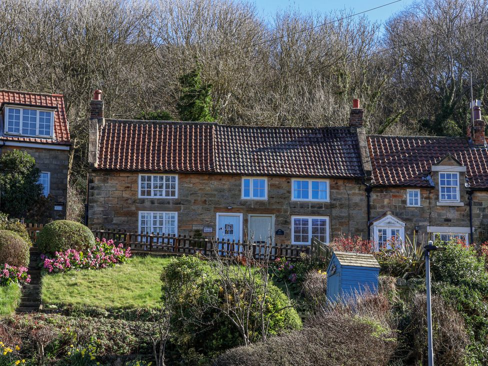 A house with a garden and flowers at Rigg Cottage, Mount Pleasant in Sandsend