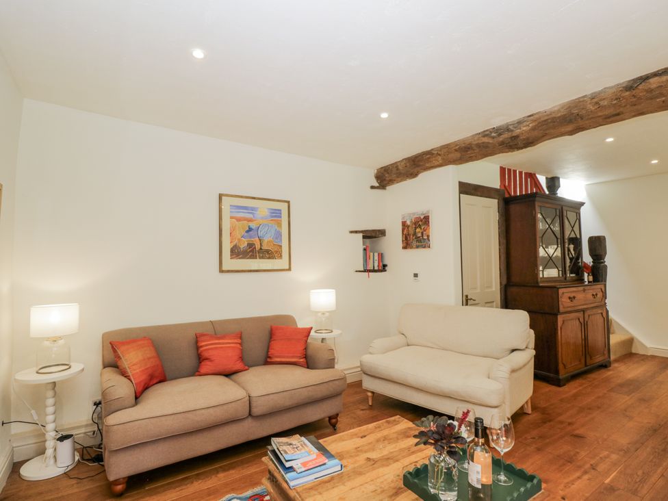 A living room with a sofa and coffee table at Stable cottage Sopworth near Sherston