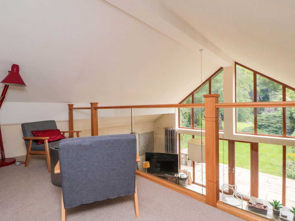 A living room with a sofa and television at Lawnswood