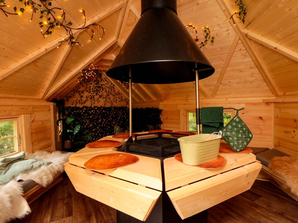 An indoor space with a wooden table and stove hood at Lawnswood
