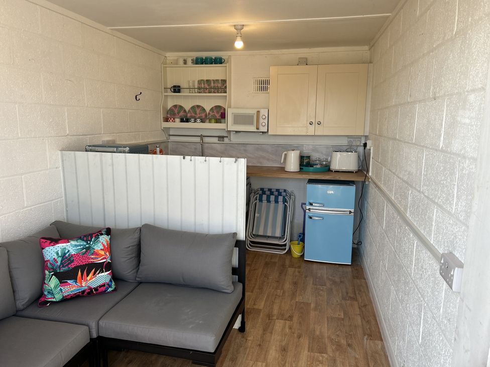A kitchen area with a counter and seating at Lawnswood in Brompton-by-Sawdon near Sherburn