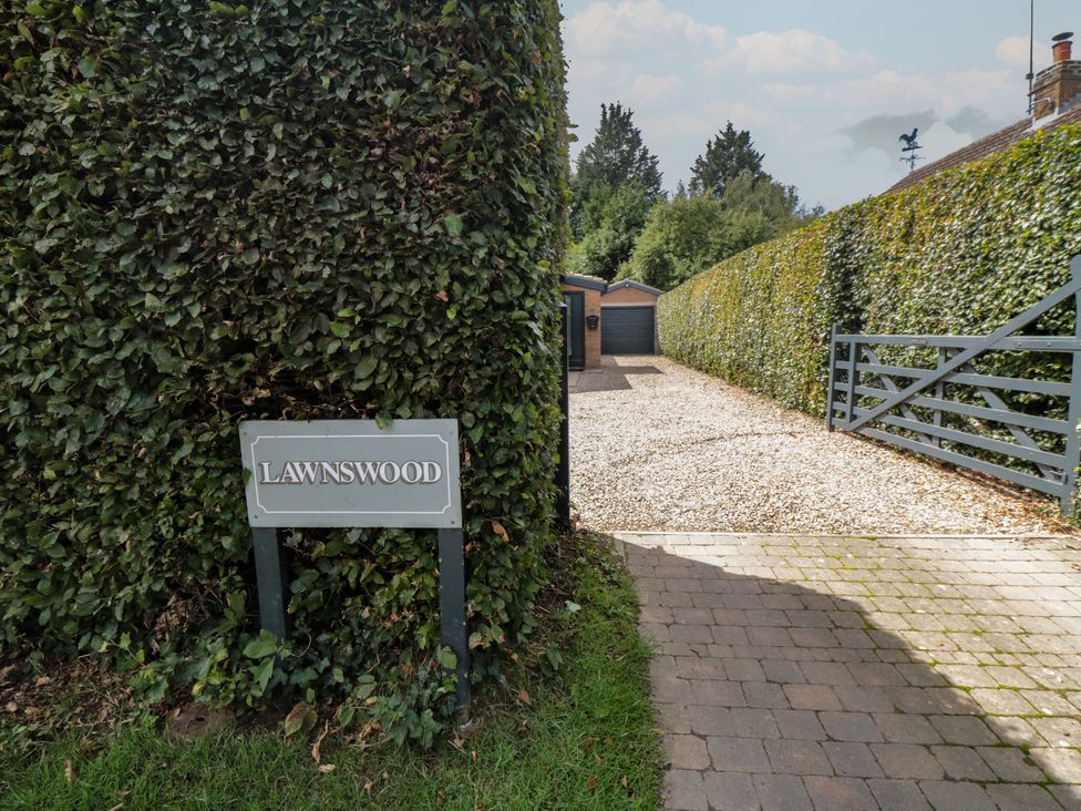 A driveway leading to a building with a sign at Lawnswood in Brompton-by-Sawdon near Sherburn