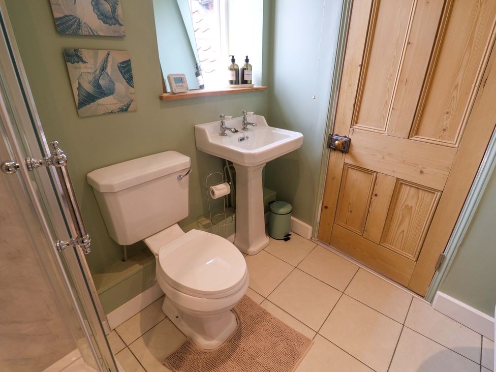 A bathroom with a sink and toilet at 11 Ballygate in Babbacombe