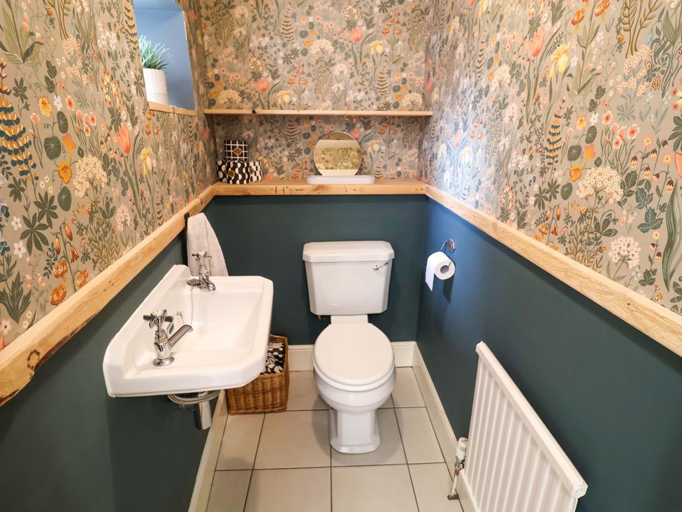 A bathroom with a sink and toilet at 11 Ballygate in Babbacombe