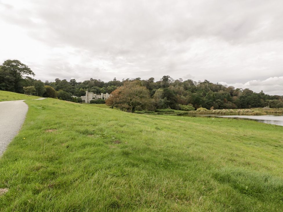 A field with a castle in the background at Sunset Cottage Gorran Churchtown