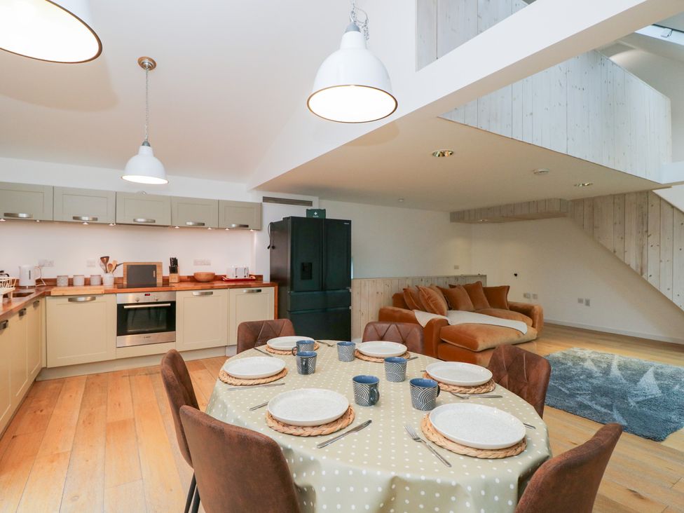 A dining room with a table set for meals at 3 The Stoneyard Bath