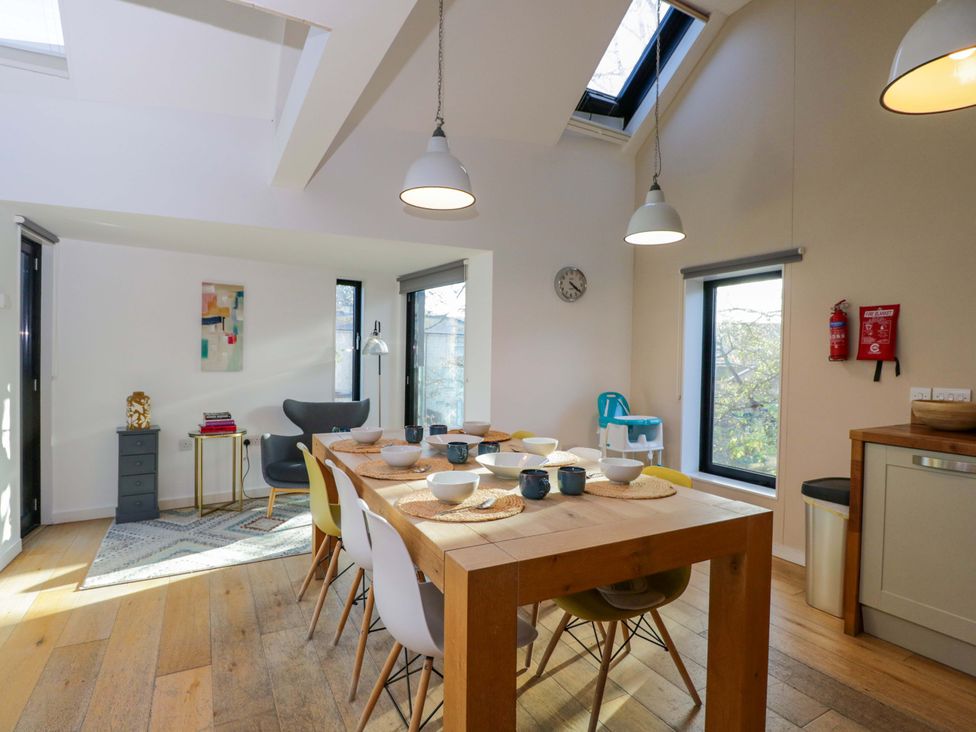 A dining room with a table and chairs at 4 The Stoneyard Bath