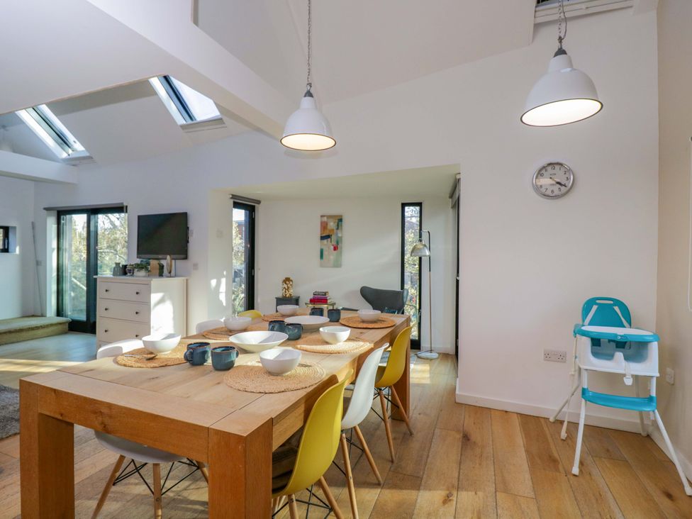 A dining room with a table and chairs at 4 The Stoneyard Bath