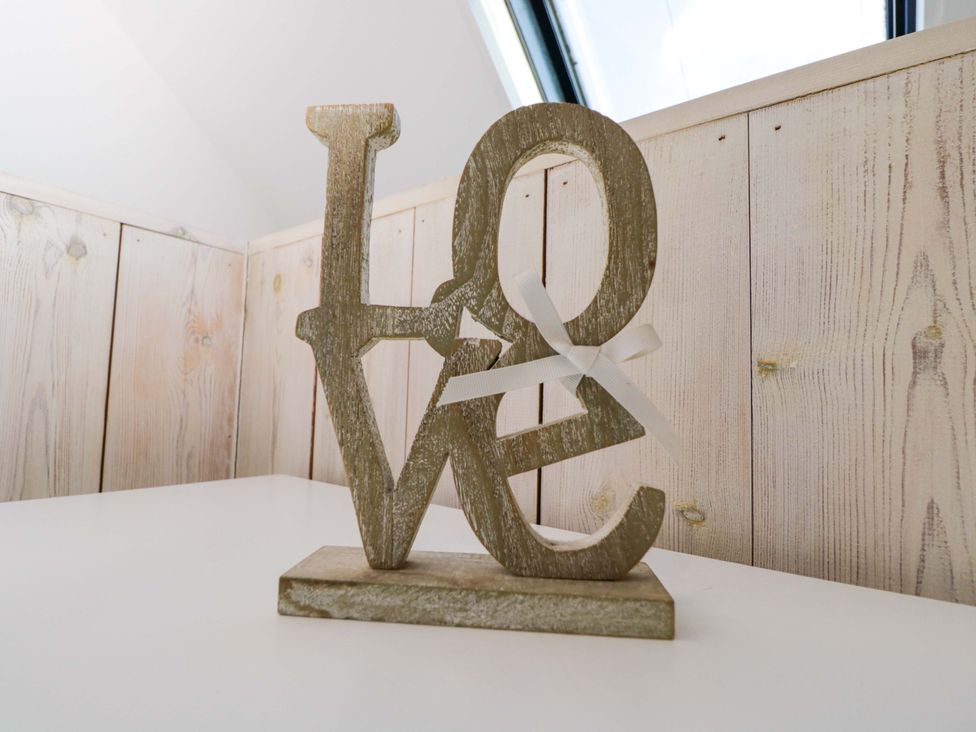 A wooden decor with letters spelling love at 4 The Stoneyard Bath