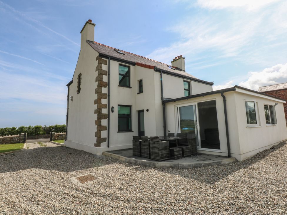 An outdoor view of a house with patio furniture at Morawelon in Pentraeth