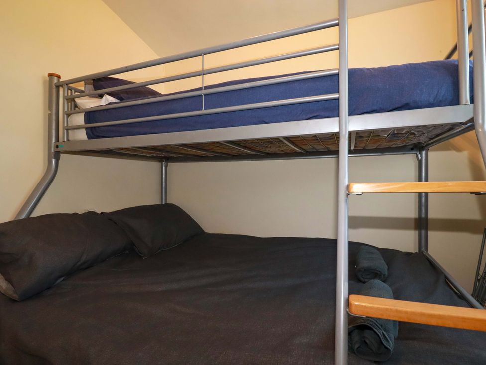 A bunk bed with two mattresses and pillows at 101 Atlantic Bays Holiday Park Padstow