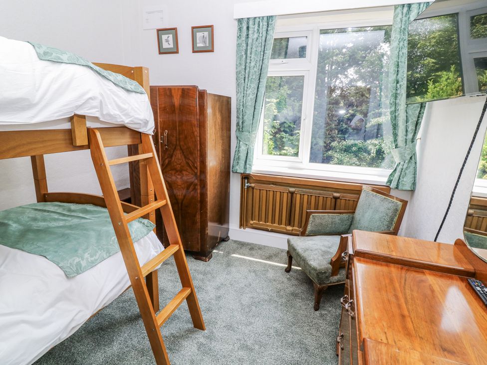 A bedroom with a bunk bed and desk at Bentfield House Rotherham near Whiston
