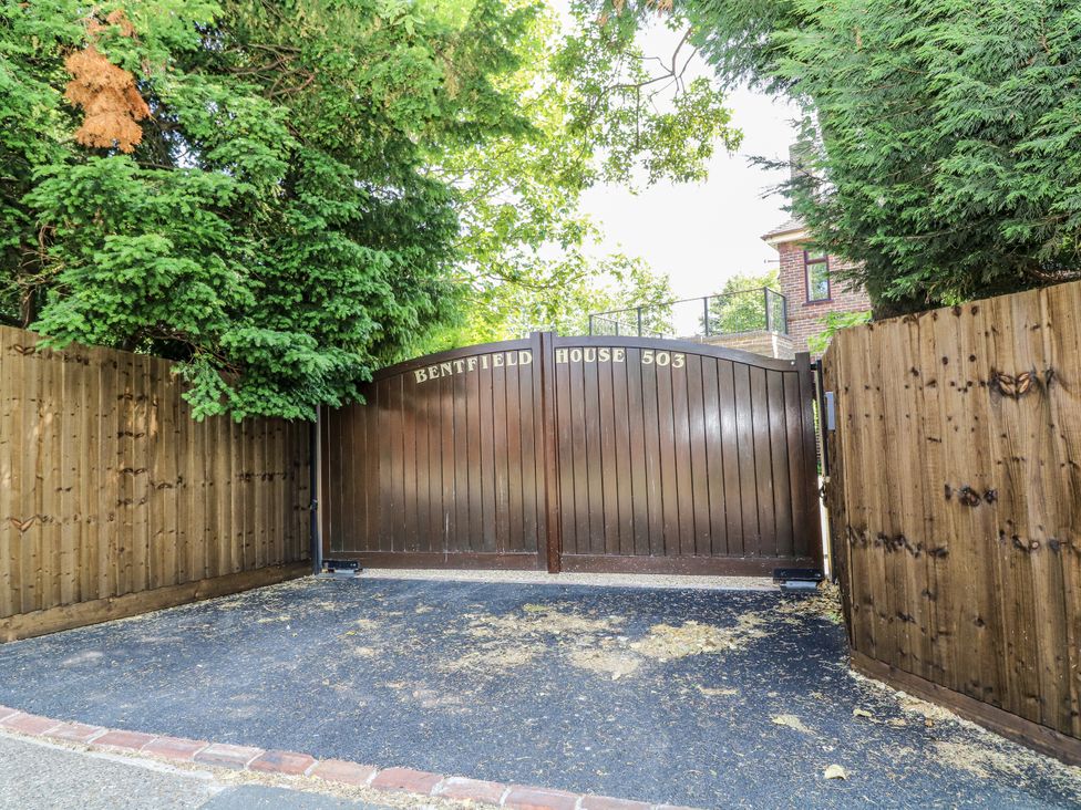 A gated entrance with a driveway at Bentfield House in Rotherham near Whiston