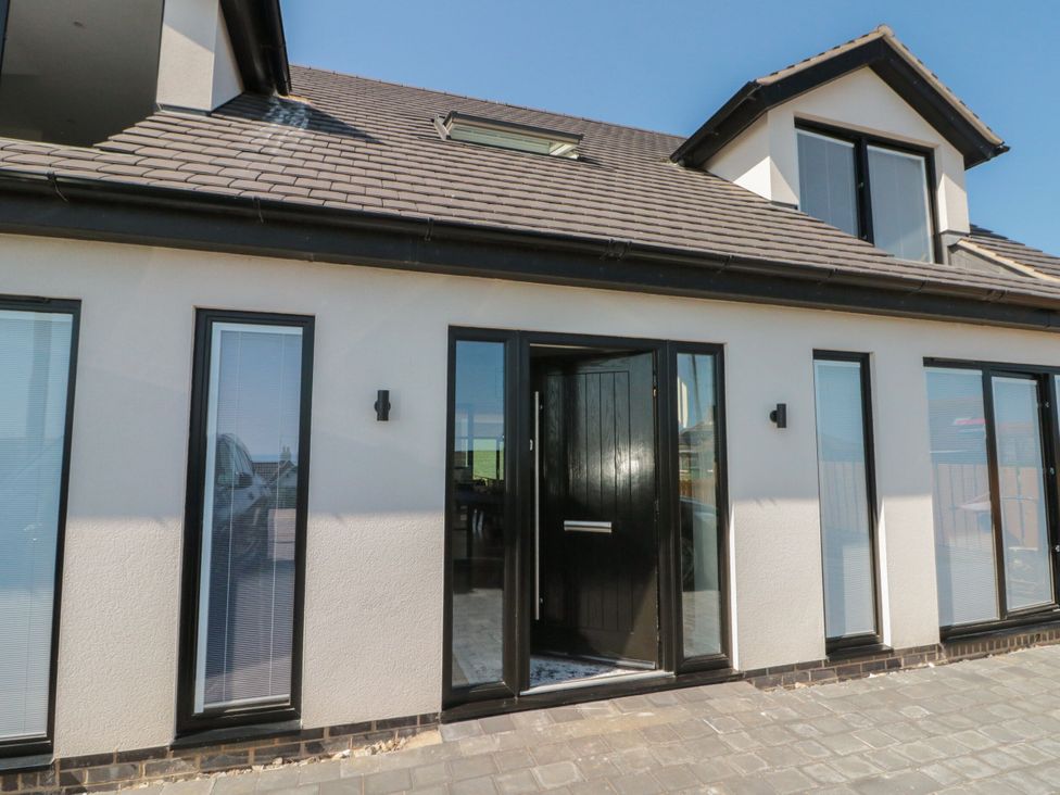 An entrance with door and windows at 12 Gap Road in Filey