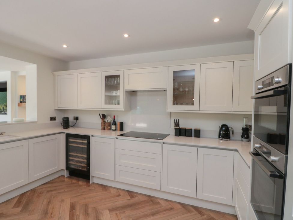 A kitchen with cabinets and appliances at 12 Gap Road in Filey