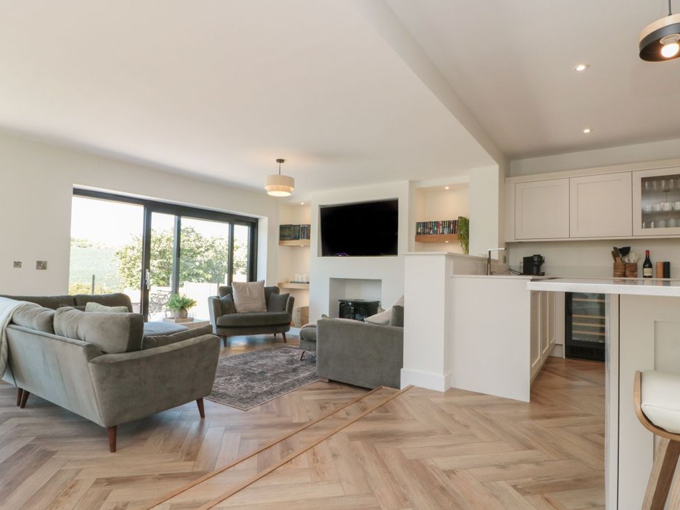 A living room with sofas and a television at 12 Gap Road in Filey