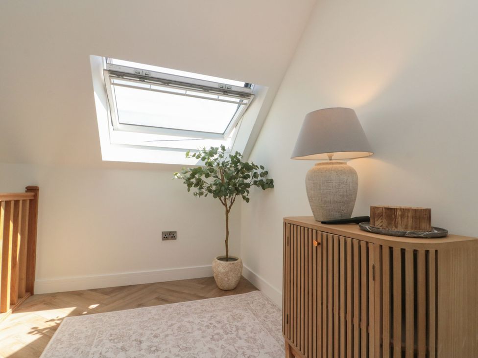 A landing area with a skylight and console table at 12 Gap Road, Filey