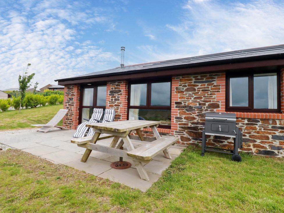 An outdoor area with table and chairs at Folly View in Cambrose near Illogan