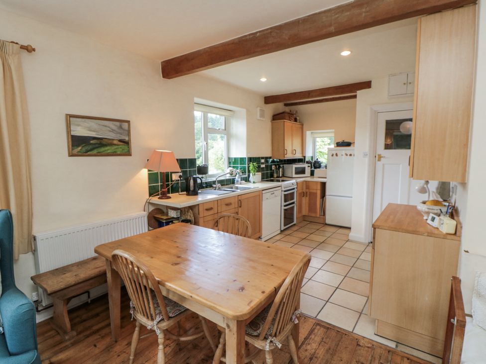 A kitchen with a table and chairs at Low Muffles Bridge 