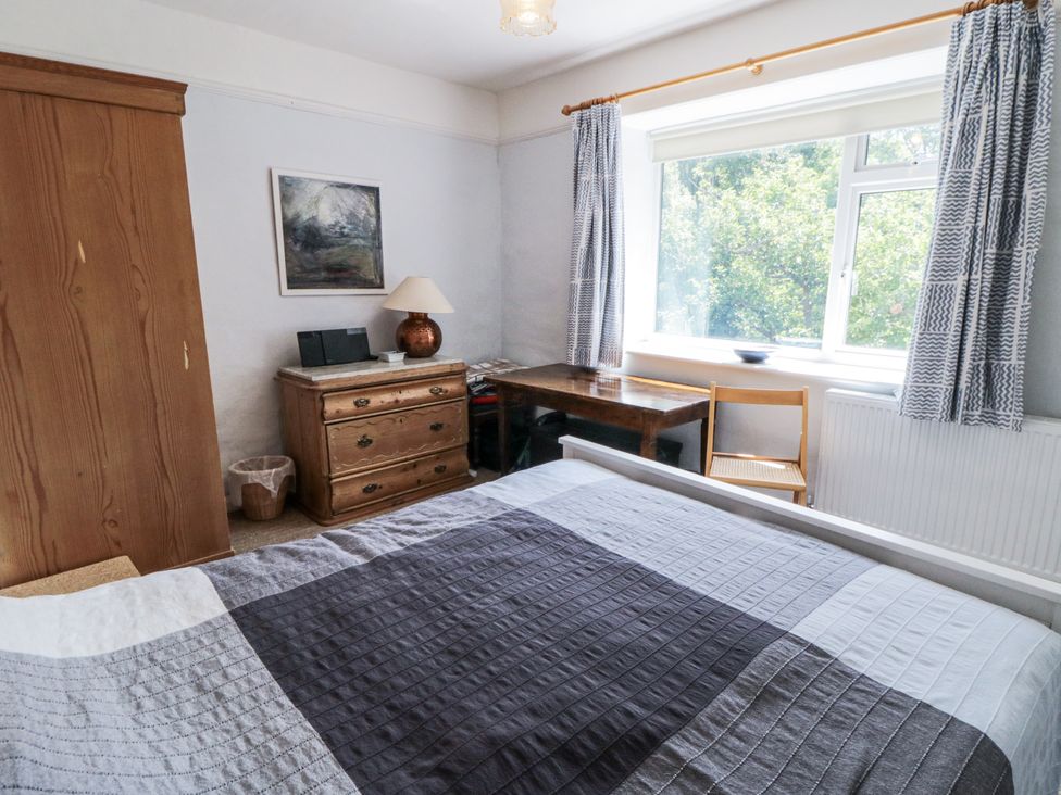 A bedroom featuring a bed, dresser, and desk at Low Muffles Bridge 