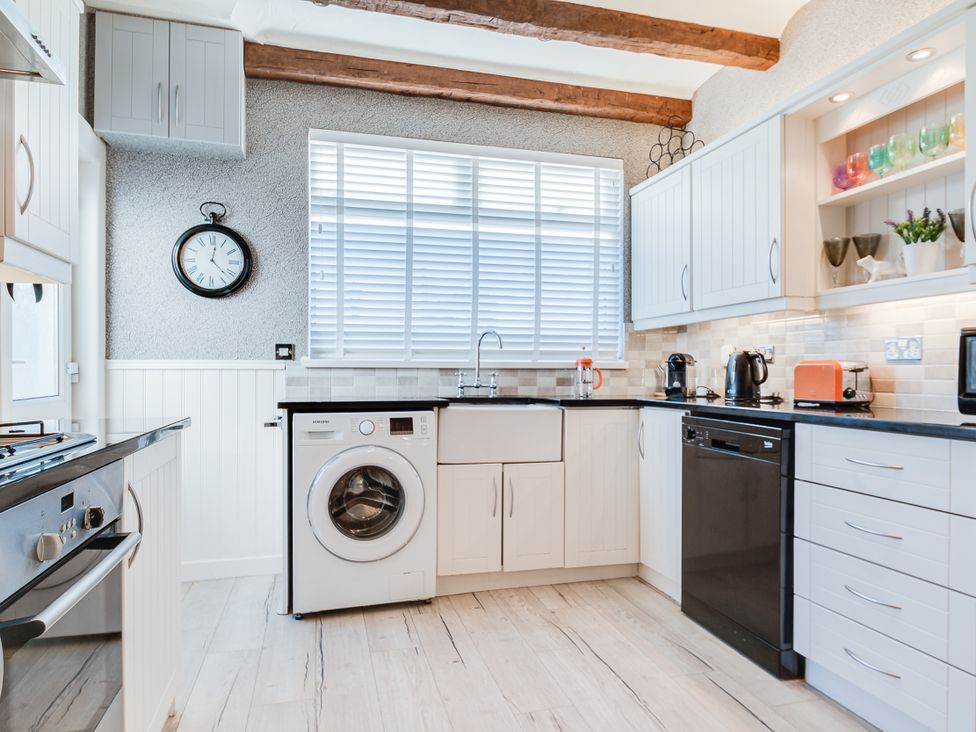 A kitchen with various appliances and cabinets at Tranquility