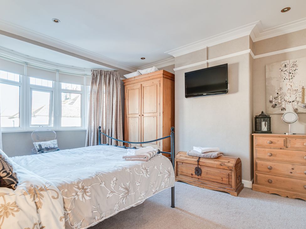 A bedroom with a bed and wardrobe at Tranquility in 