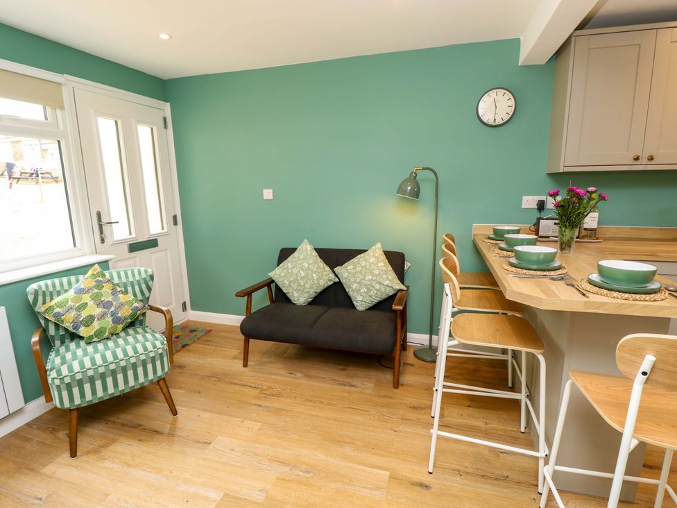 A dining room with a table and chairs at No 157 Sandown Bay Holiday Chalet 'Field View' Sandown