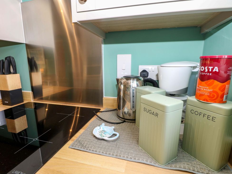 A kitchen with kettle and coffee maker at No 157 Sandown Bay Holiday Chalet 'Field View' Sandown